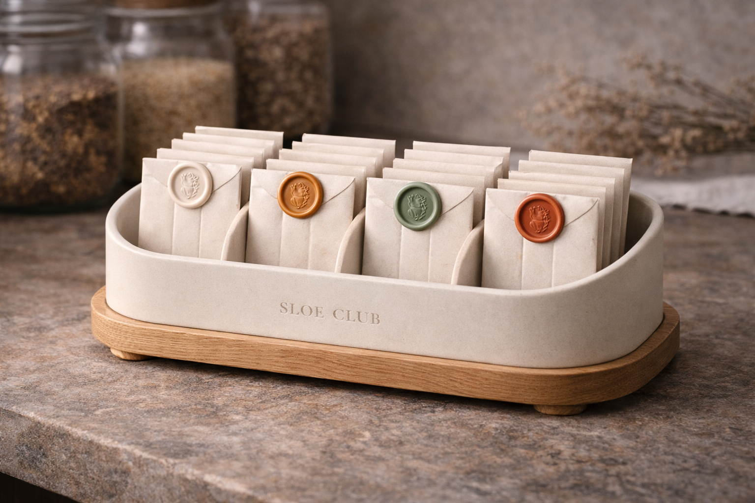 Sloe Club Oak Refill Pantry Caddy open on kitchen shelf with botanical sachets, monthly refill subscription